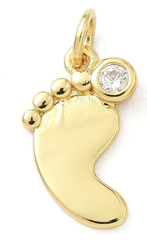Gold baby foot charm with a polished gold-tone finish and a clear bezel-set stone on the big toe.