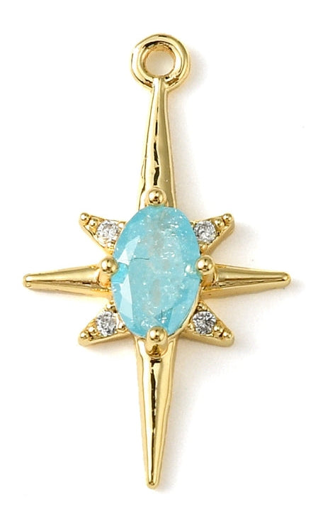 A blue opal star gold-tone charm in an eight-point starburst shape with a central light blue stone and crystal accents.