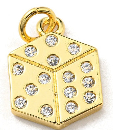 Gold-tone charm in the shape of a 3D die, featuring clear crystal stones as pips.