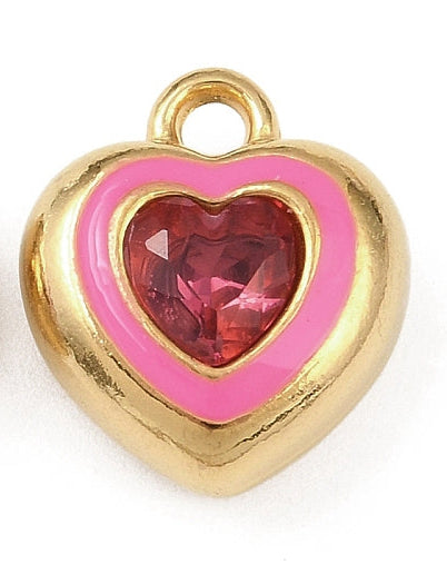 Gold-tone charm featuring a faceted pink crystal heart in a hot pink bezel setting.