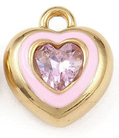 Heart-shaped gold-tone charm with a light pink enamel inlay and a faceted light pink heart crystal center.