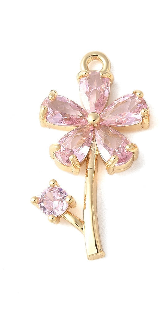 Gold-tone pink flower charm featuring faceted pink crystal petals on a stem with a small pink crystal bud.
