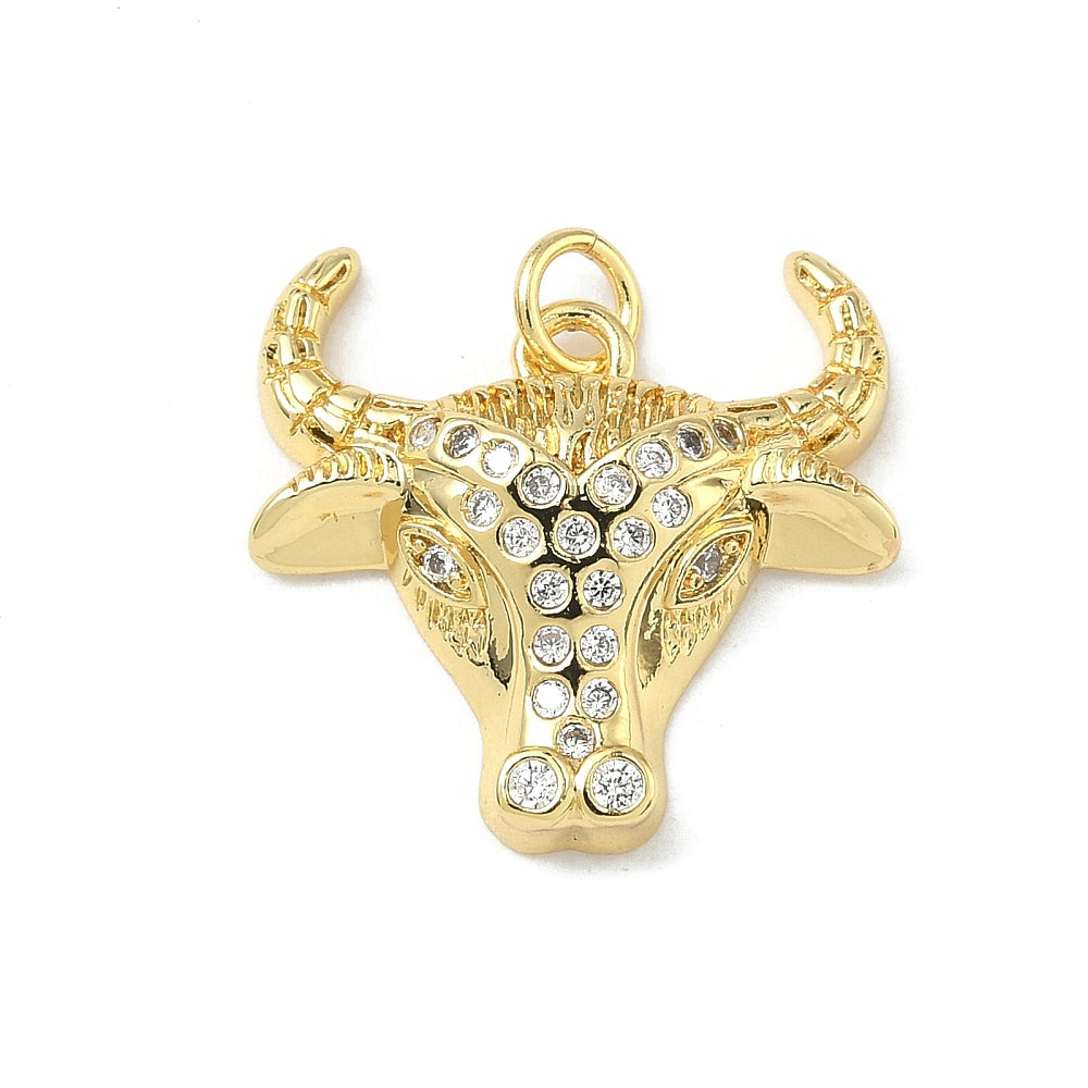 Gold-tone charm featuring a cow head design embellished with clear rhinestones down the center and curved horns.