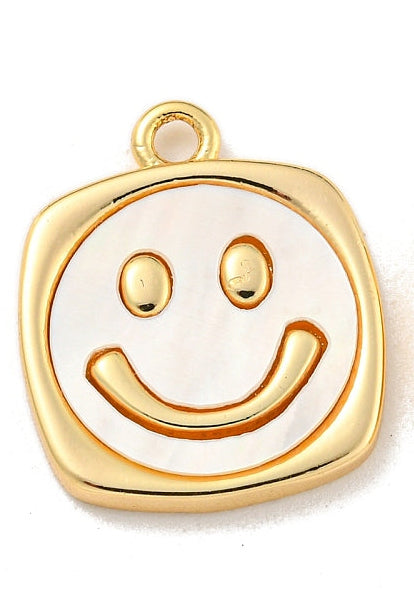 Gold-tone charm featuring a raised gold smiley face on a pearlescent white inlay within a rounded square frame.