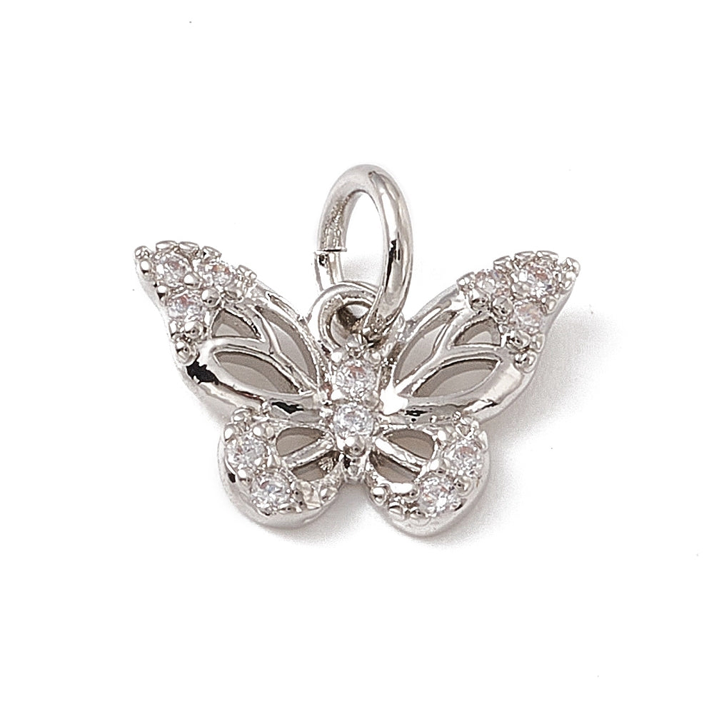 A silver butterfly charm with clear stone accents on the wings and body, attached to a jump ring.