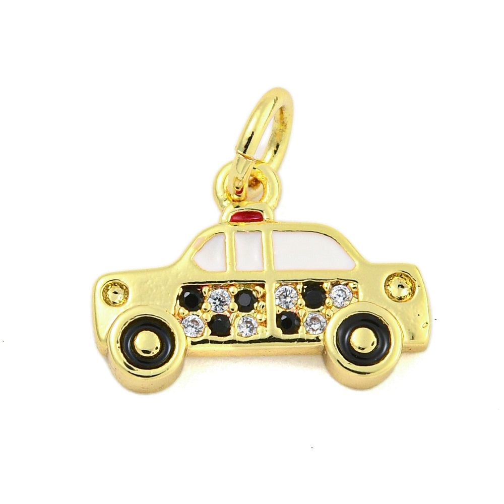 A gold taxi charm featuring white enamel windows, black and clear stone checkered details, and a gold-tone bail.