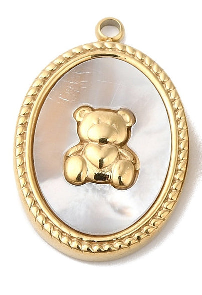 Oval gold-tone charm featuring a mother-of-pearl background and a small gold teddy bear holding a heart.