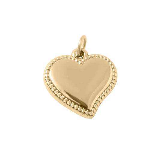 A heart-shaped gold-tone charm with a polished smooth center and a beaded border, featuring a small top bail.