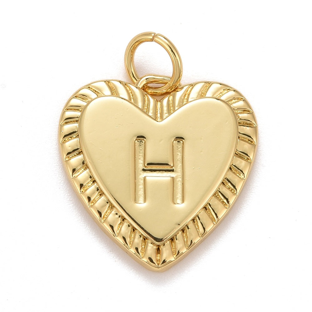 Gold-tone charm in a heart shape featuring a textured, ridged border and an embossed letter H.