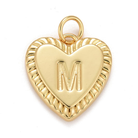 Gold-tone initial charm shaped like a heart with an embossed letter M and a textured ribbed border.