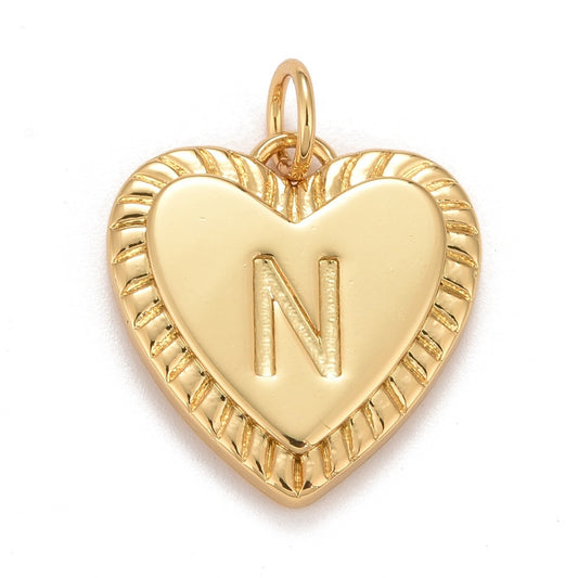 Gold-tone heart initial charm featuring an engraved letter N with a ridged, textured border and top attachment loop.