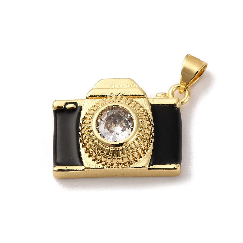 Gold-tone camera charm with black enamel panels and a clear round stone lens on a white background.