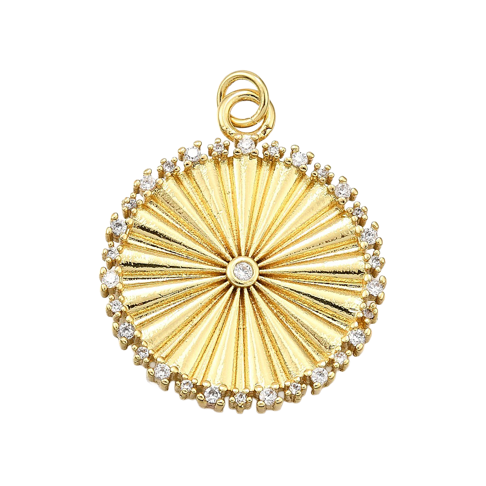 Gold circle pendant featuring a radiating sunburst texture, a central clear stone, and a crystal-studded border.