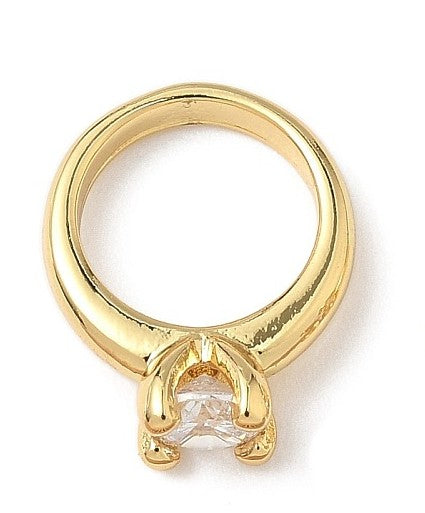 Gold-tone charm shaped like a solitaire diamond ring with a clear faceted stone in a four-prong setting.