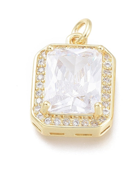Gold-tone charm featuring a large, clear emerald-cut stone surrounded by a halo of small pave crystals.