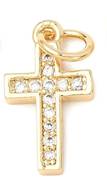 A CZ gold cross charm in a gold-tone setting paved with clear stones and a top jump ring.
