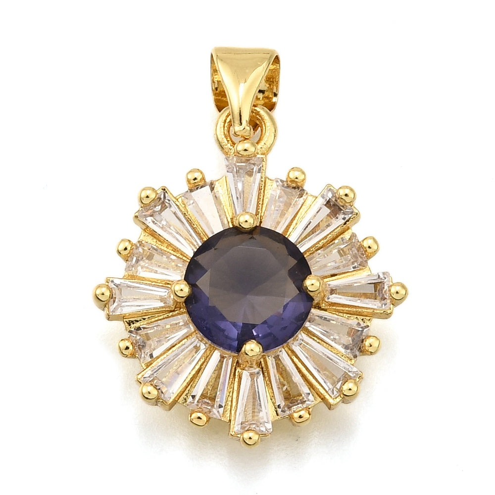 Gold-tone blue vintage pendant featuring a round dark blue center stone surrounded by a sunburst of clear baguette crystals.