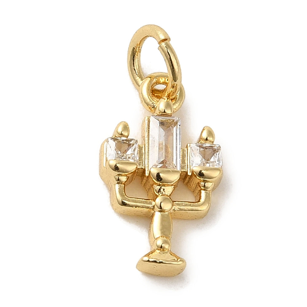 Gold candle stick charm in a three-arm candelabra design, detailed with clear rectangular stones and a top jump ring.