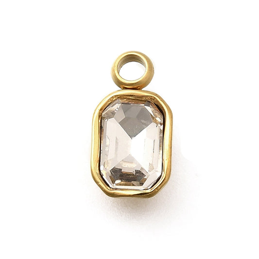Emerald-cut clear crystal in a gold-tone bezel charm with a top attachment loop.