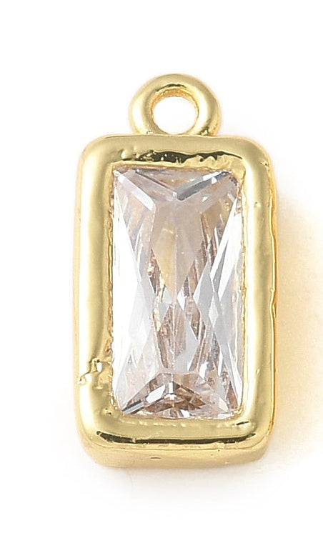 Rectangular gold bezel stone charm featuring a clear, faceted crystal in a gold-tone setting with a top loop.
