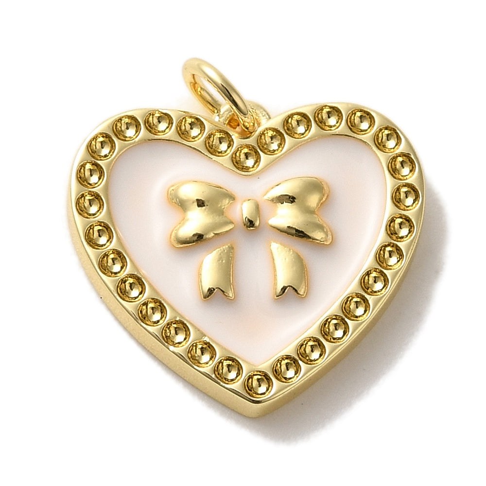 Heart bow gold-tone charm featuring a light pink enamel background, raised gold bow, and a dotted border.