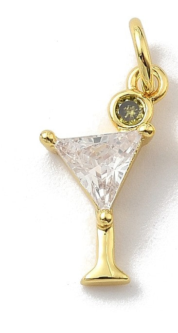 Gold-tone charm shaped like a martini glass featuring a triangular clear stone and a round green stone olive.