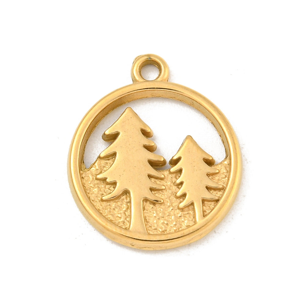 Circular gold-tone charm featuring a cutout design of two evergreen trees on a textured ground.