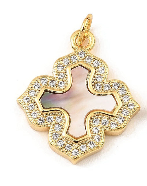 Gold mother of pearl cross charm with an iridescent center and a scalloped border set with clear stones.