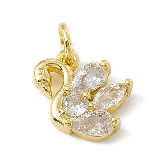 A gold swan charm featuring clear, faceted pear-shaped and round stones set in gold-tone metal with a top loop.