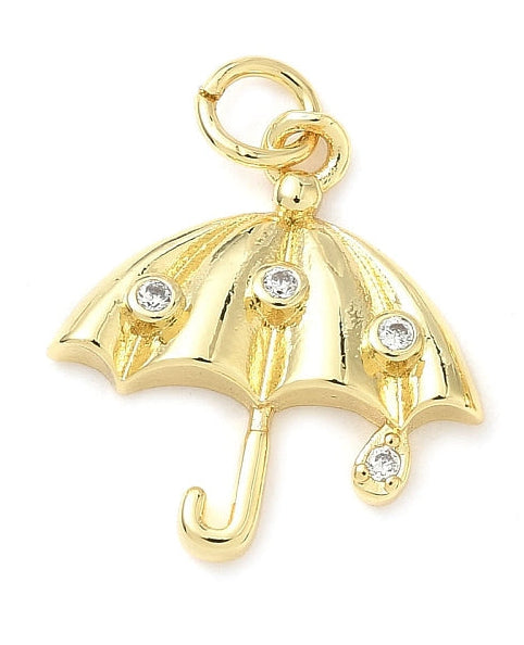 Gold-tone umbrella charm with clear bezel-set crystal accents and a top jump ring, shown against a white background.