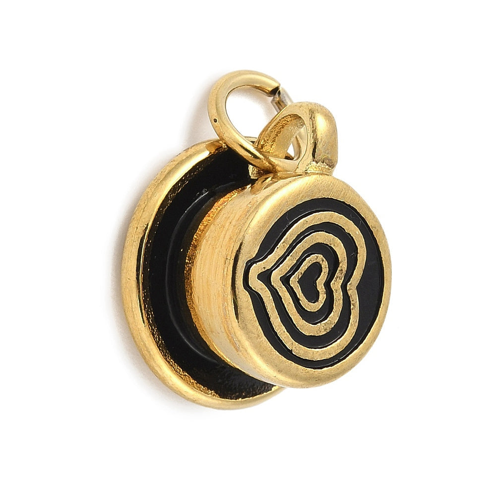 Gold-tone charm shaped like a latte cup and saucer with black enamel heart art.