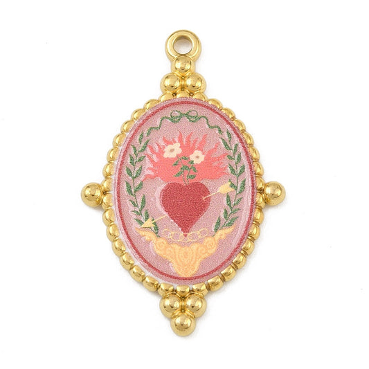 Oval gold-tone charm featuring a pink and red vintage heart illustration under a clear dome, framed with beaded detailing.