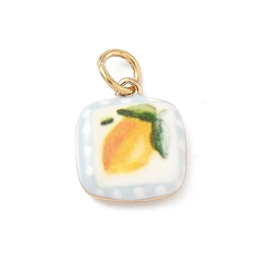 Vintage lemon gold-tone charm with a painted yellow lemon illustration on a rounded square enamel tile.