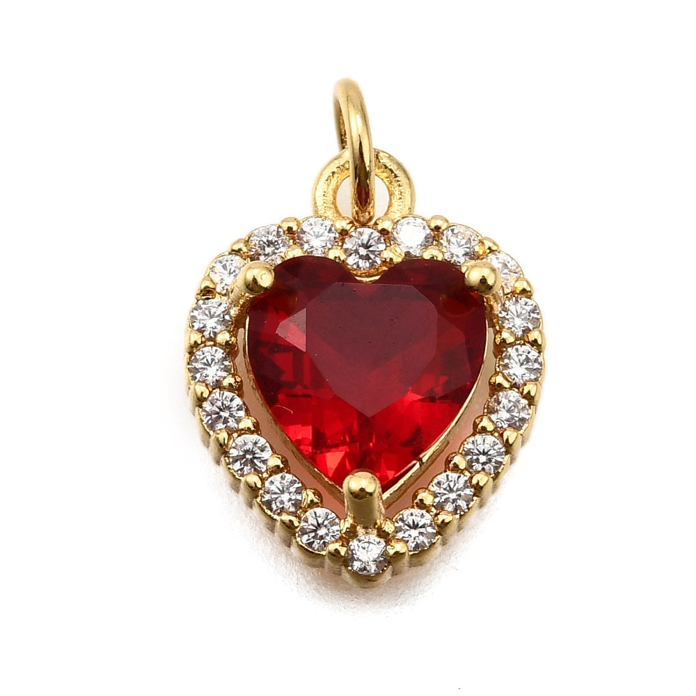 Gold-tone charm featuring a faceted vintage red heart stone framed by a halo of small clear stones.