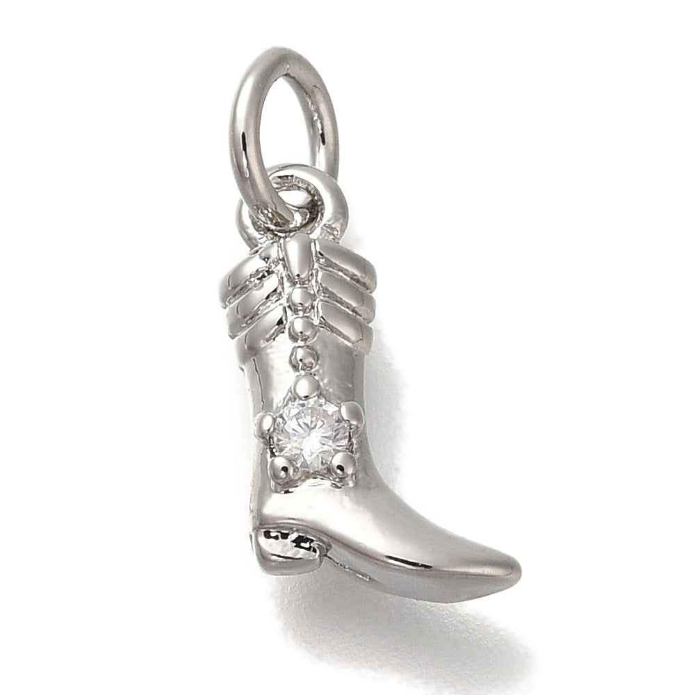 Silver cowgirl boot charm featuring detailed western designs, a clear stone accent, and a top jump ring.