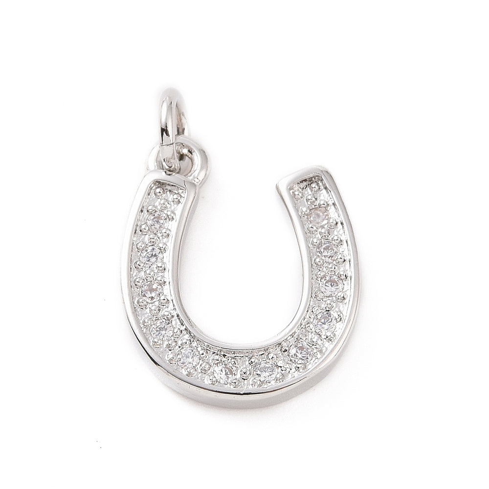 A silver horseshoe charm paved with small, clear stones, featuring a top loop for attachment.