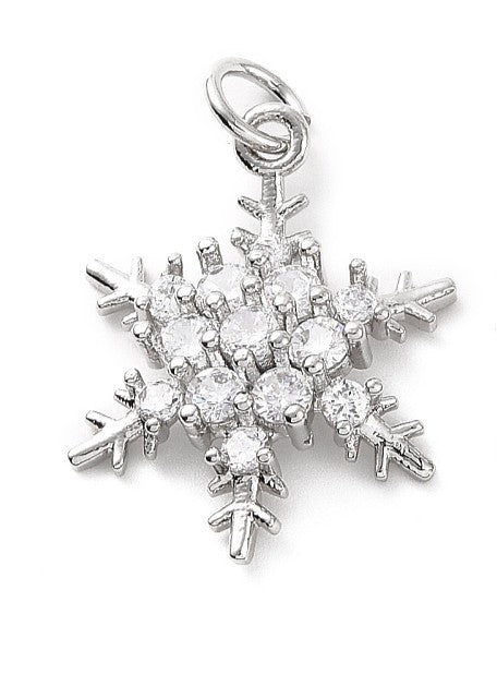 Silver snowflake charm set with small clear round stones, featuring a top jump ring attachment.
